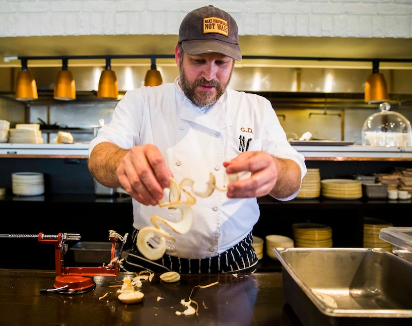 Chef Graham Dodds makes pickled black radish using a spiralizer on Thursday, March 31, 2016...