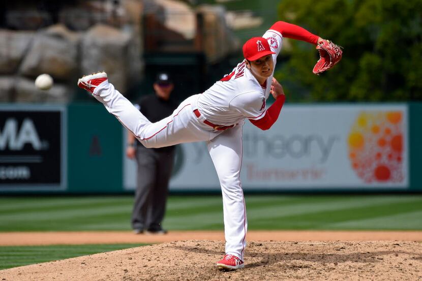 Los Angeles Angels starting pitcher Shohei Ohtani, of Japan, throws to the plate during the...