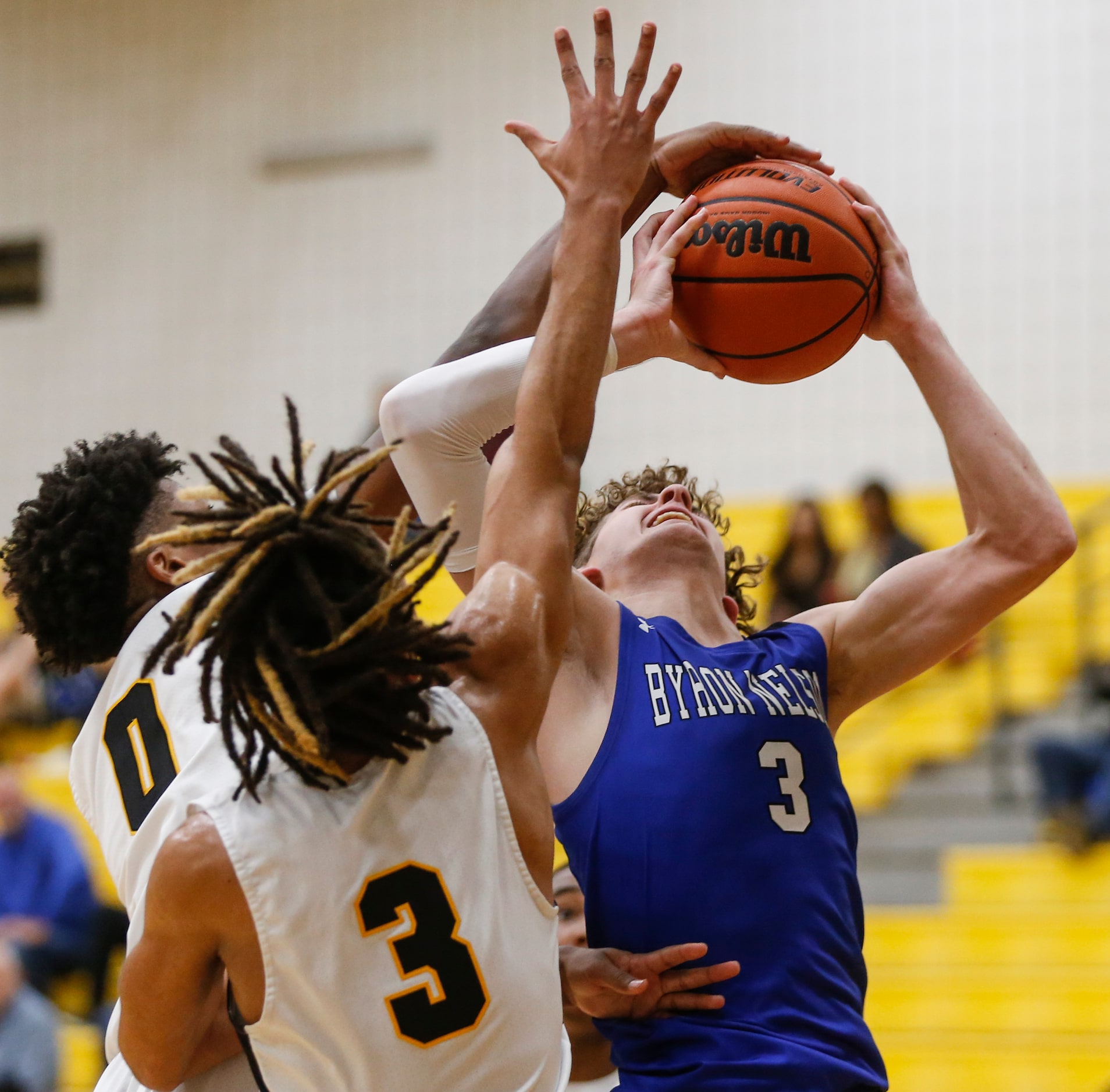 Byron Nelson High School Finley Bizjack (3) attempts to shoot the ball while Fossil Ridge...