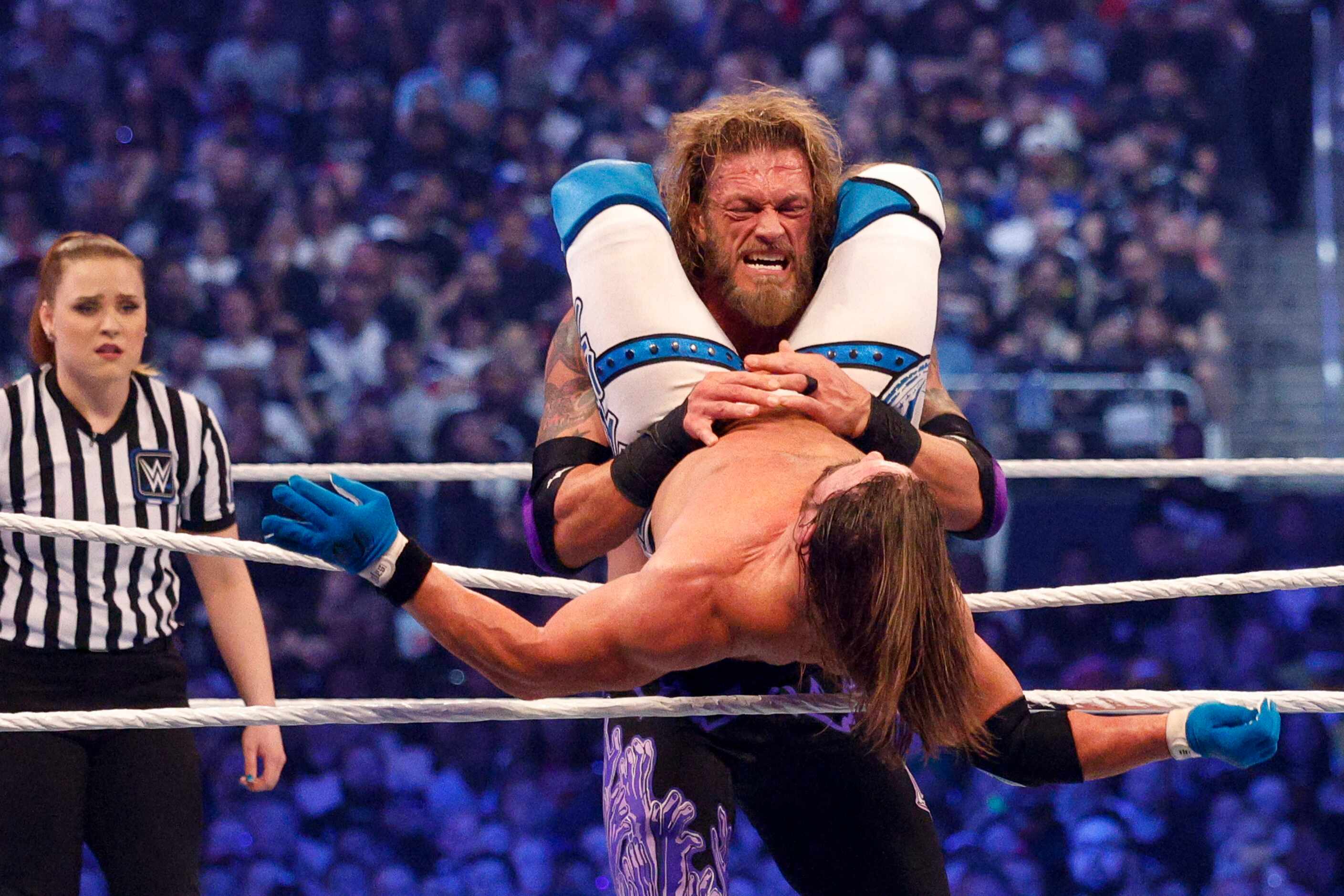 Edge slams AJ Styles into the ropes during a match at WrestleMania Sunday at AT&T Stadium in...