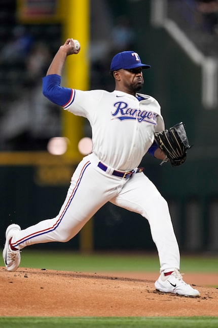 Texas Rangers starting pitcher Kumar Rocker threw to the Toronto Blue Jays in the first...