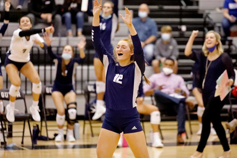 Flower Mound's Angelique Cyr (12) celebrates a point during a 25-22, 25-19, 25-19 win over...