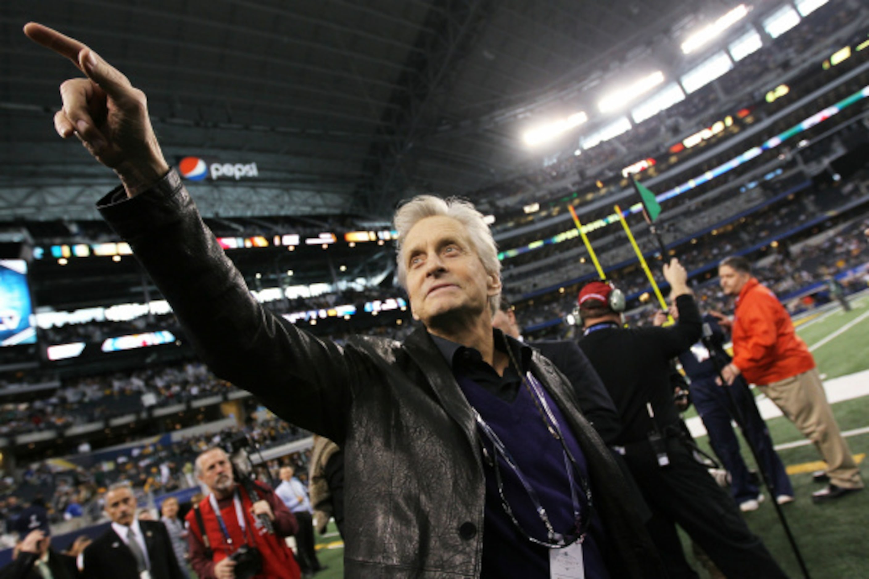 Actor Michael Douglas walks on the sidelines before the Pittsburgh Steelers play against the...