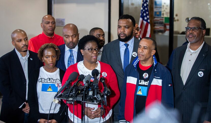 Allison Jean, Botham Shem Jean's mother, center, gives remarks during a press conference at...