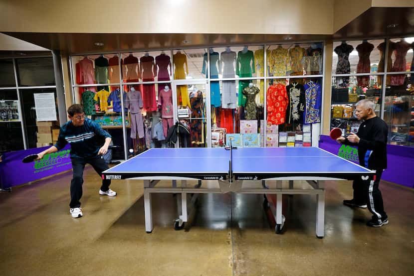 Asia Times Square Table Tennis members Mike Nguyen, left, and Duc Nguyen play table tennis...