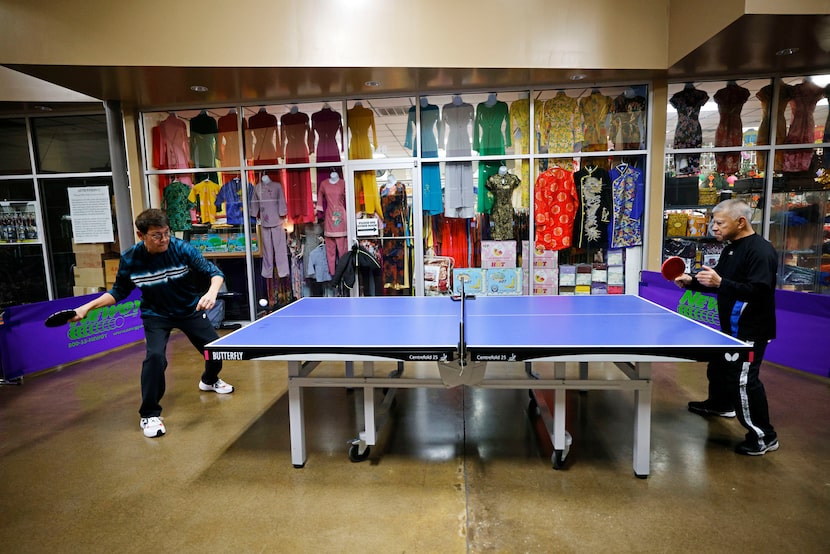 Asia Times Square Table Tennis members Mike Nguyen, left, and Duc Nguyen play table tennis...