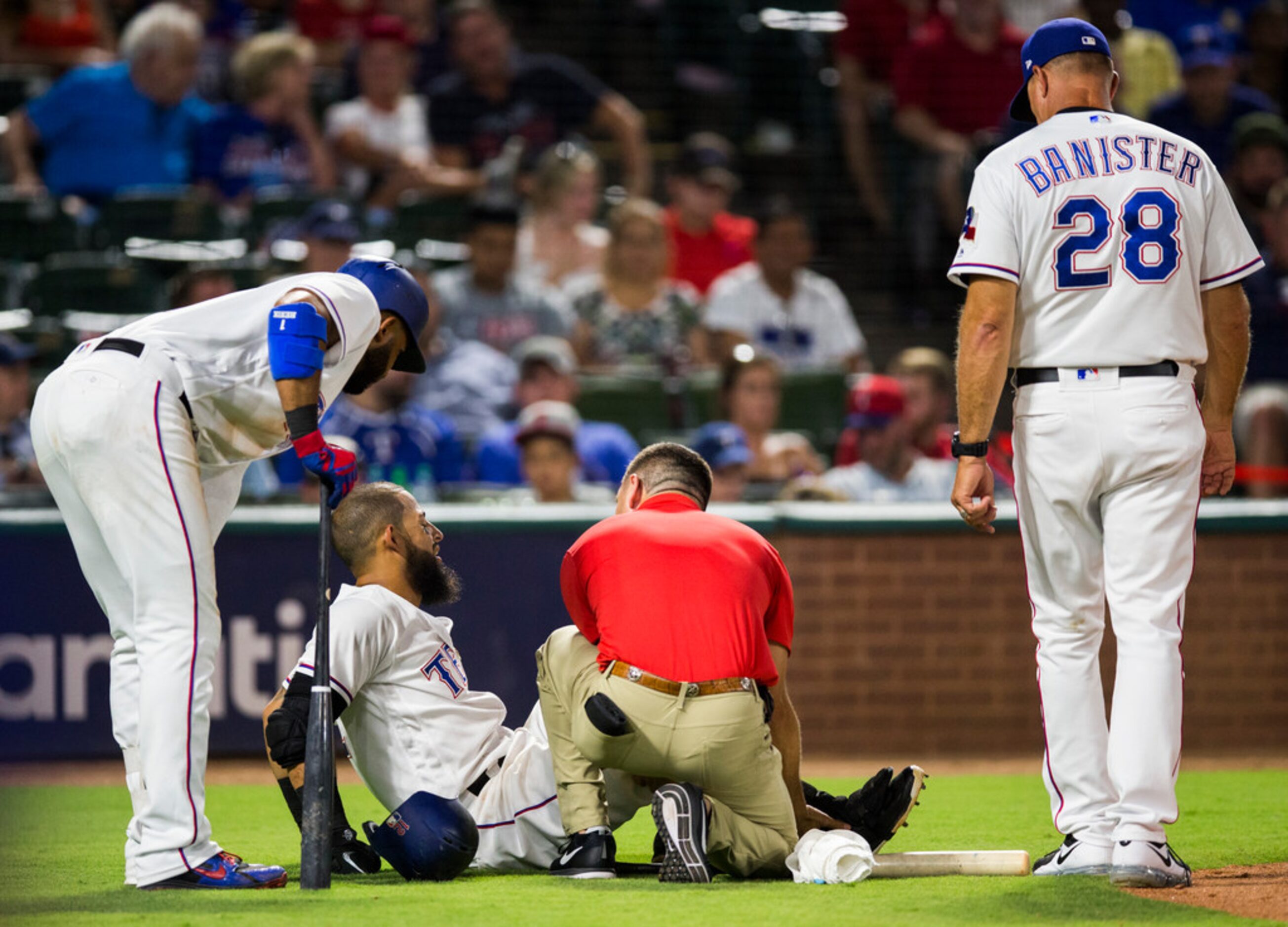 Texas Rangers second baseman Rougned Odor (12) is checked out after fouling a ball off his...