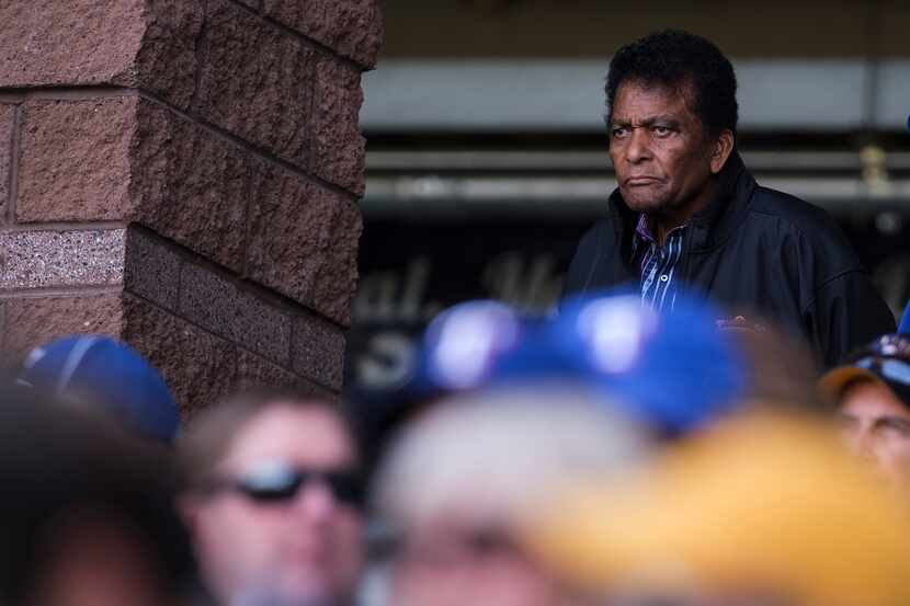 Country singer Charley Pride watches the Texas Rangers play the Milwaukee Brewers during the...