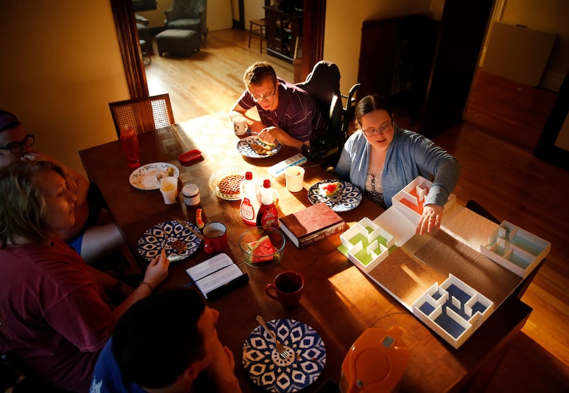 Lisa Hancock shows fellow Cochran House residents rooms in a model she created of the Julian...