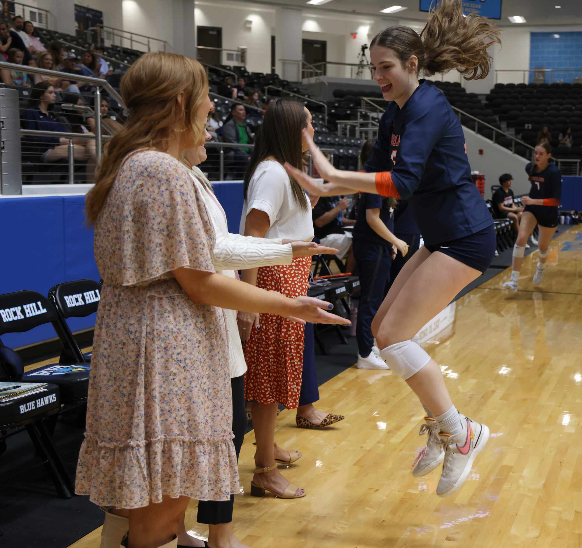 Frisco Wakeland's Hannah Lee (6) leaps with enthusiasm during player introductions prior to...