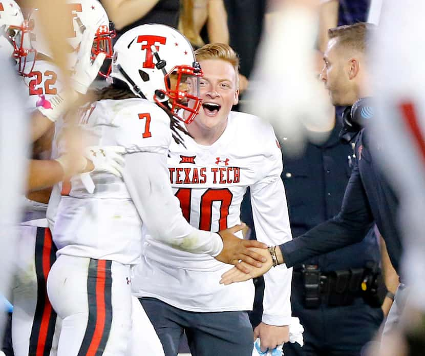 FILE - Texas Tech quarterback Jett Duffey (7) is congratulated by injured quarterback Alan...