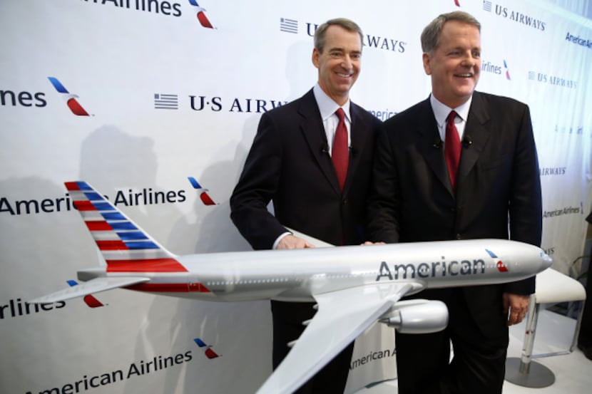 Tom Horton (left) and Doug Parker were all smiles when they announced the merger of American...