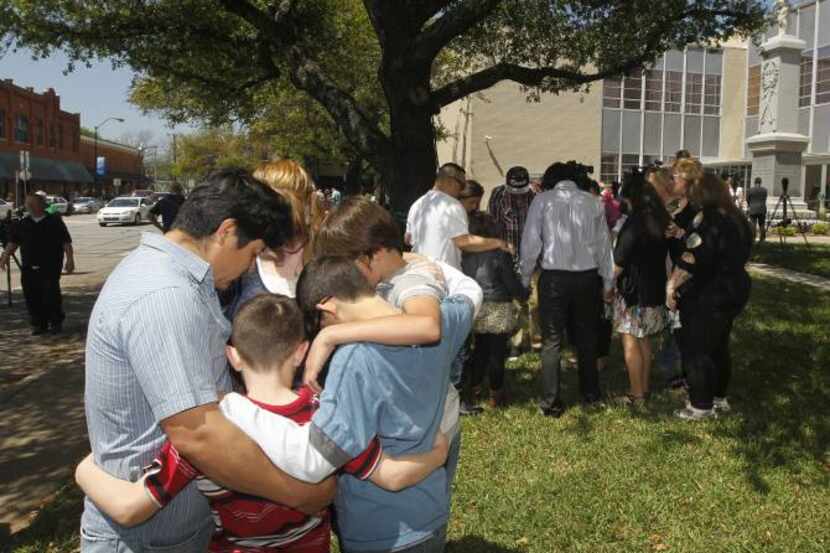 Families gathered for a prayer walk around the Kaufman County Courthouse in Kaufman on April...