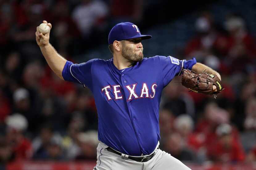 Texas Rangers starting pitcher Lance Lynn throws against the Los Angeles Angels during the...