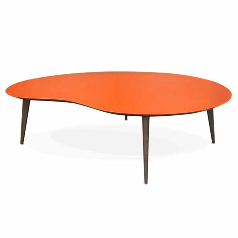 Jonathan Adler's glossy lacquered orange or white kidney tabletop has walnut legs. It is...