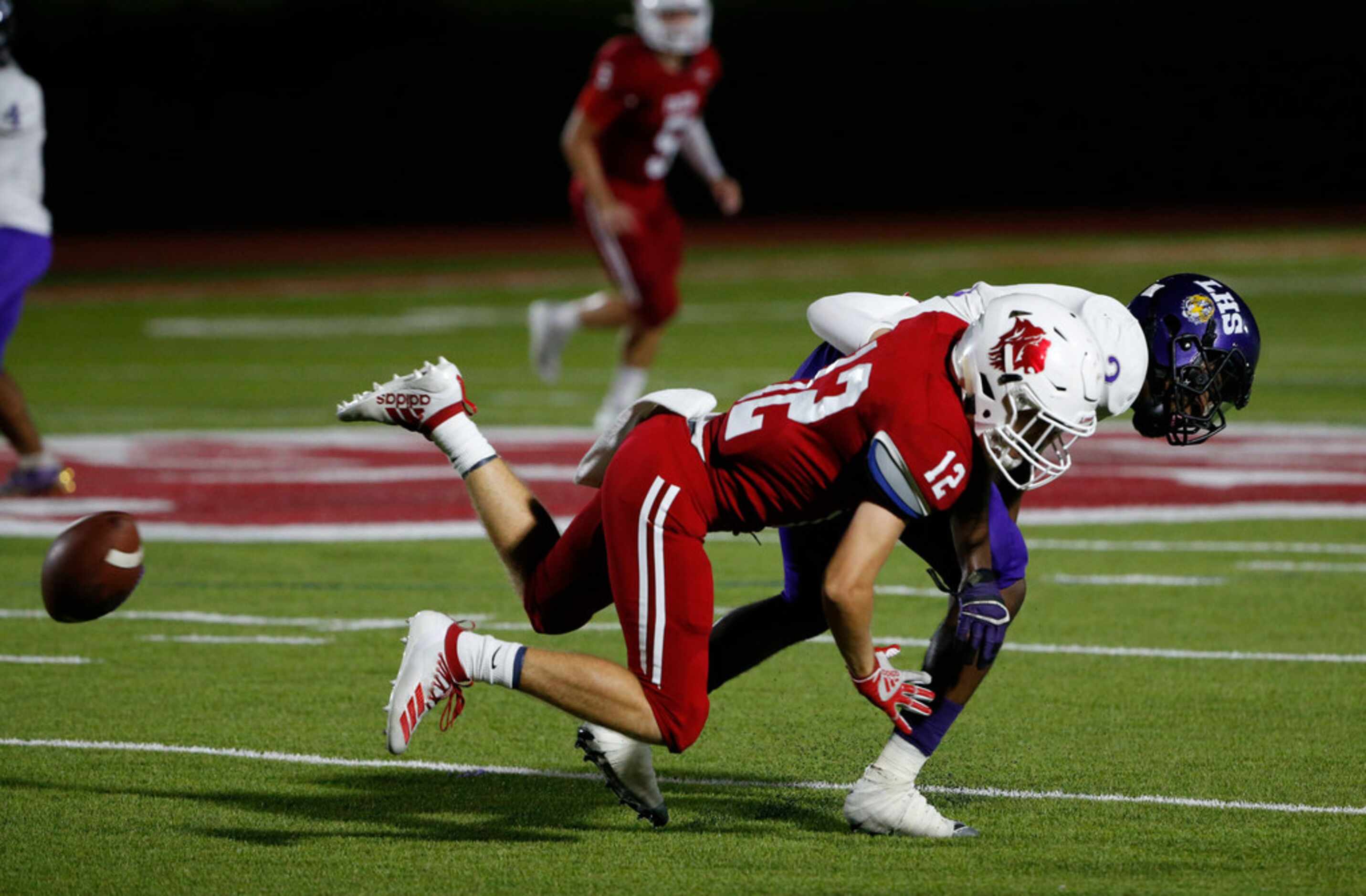Grapevine Faith Christian's Kaleb Rysavy (12) deflects a pass intended for Lincoln's Kenneth...