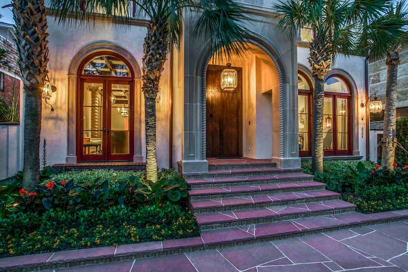 The Santa Barbara-style design features handcrafted details like the elaborate entryway...