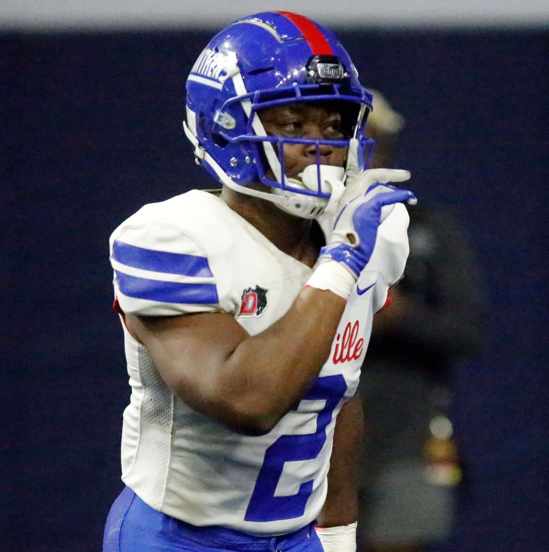 Duncanville High School running back Jordan Crook (2) signals the crowd to hush after...