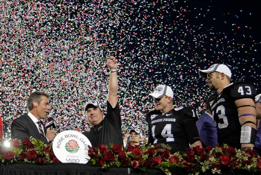 Head coach Gary Patterson, TCU Horned Frogs quarterback Andy Dalton (14) and linebacker Tank...