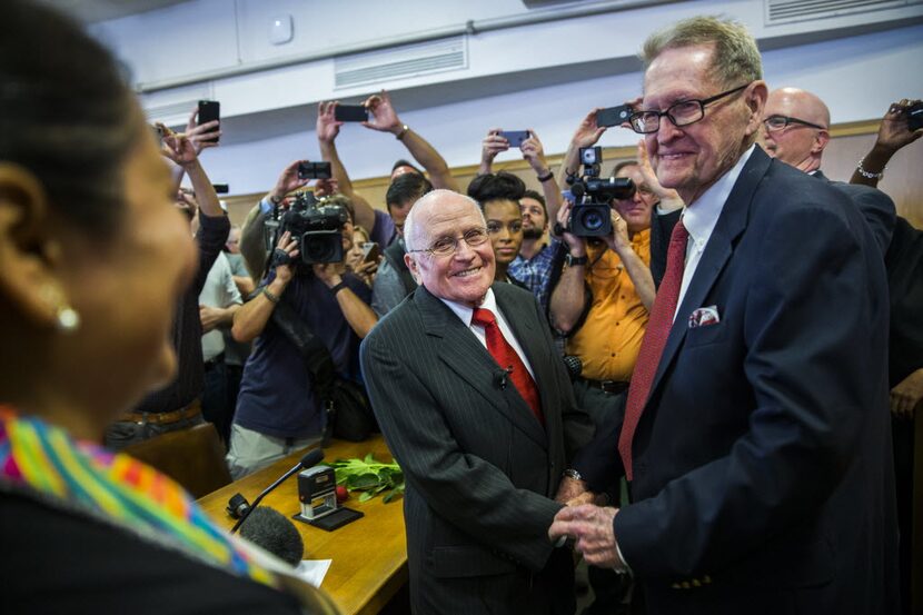 After 54 years as a couple, George Harris, center, and Jack Evans, right, were married by...