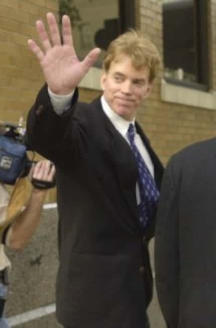  Duke waves after walking away from the federal courthouse in New Orleans, Dec. 18, 2002....