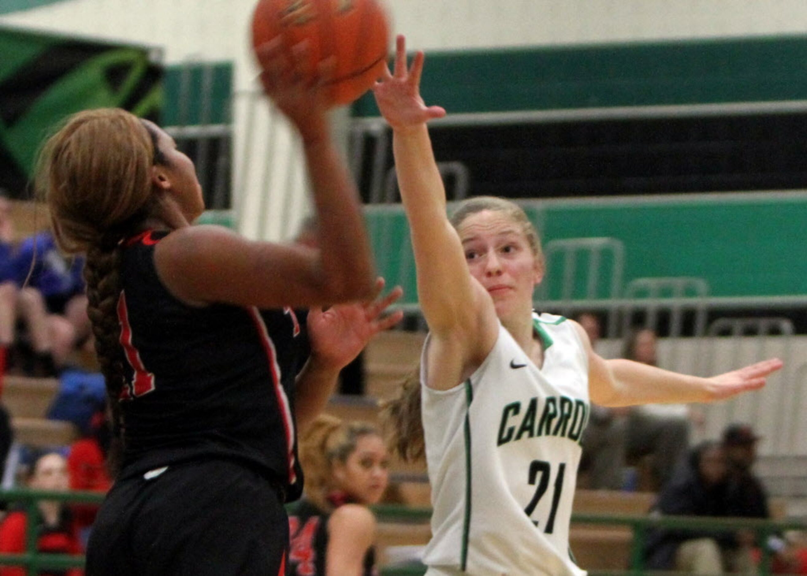 Southlake Carroll guard Brooke Lay (21) applies pressure to Euless Trinity guard Te ana...