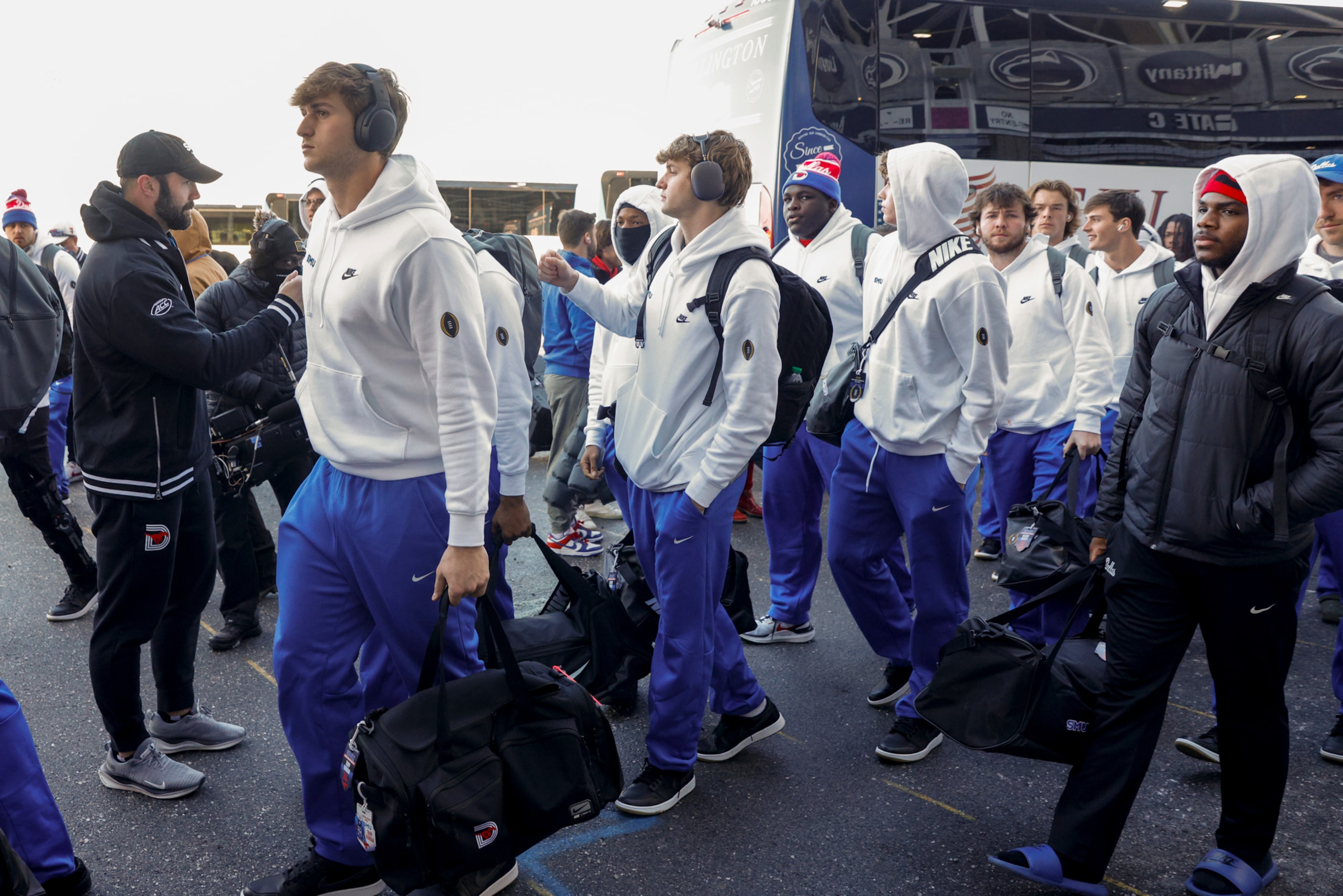 SMU players arrive at Beaver Stadium before a game against Penn State in the first round of...