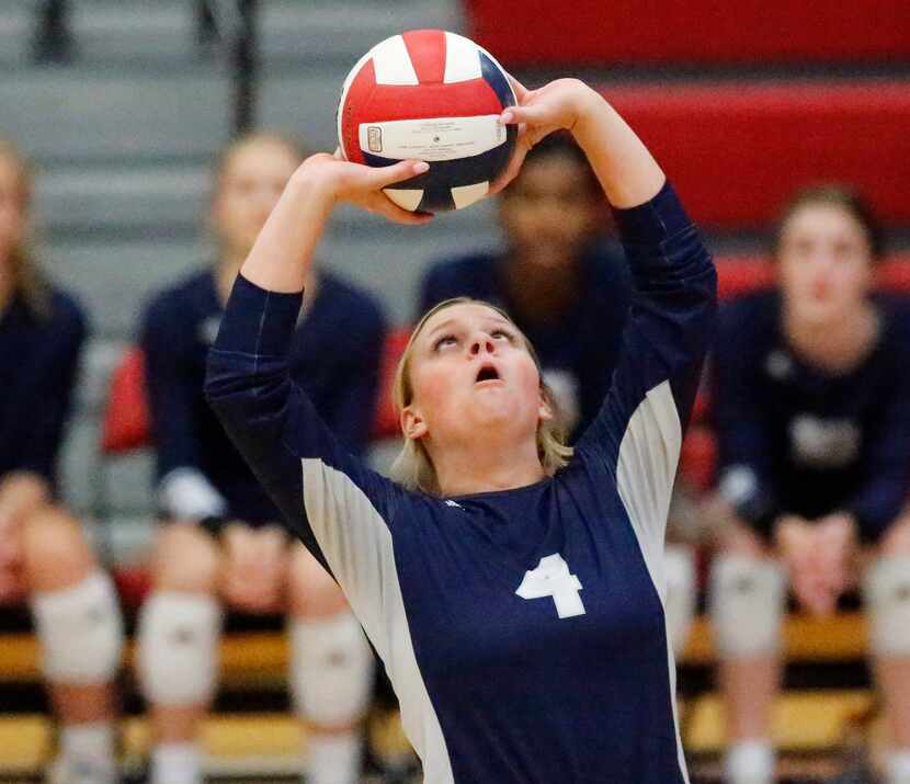 Flower Mound High School setter Avery Miller (4) makes a set during game one as McKinney...