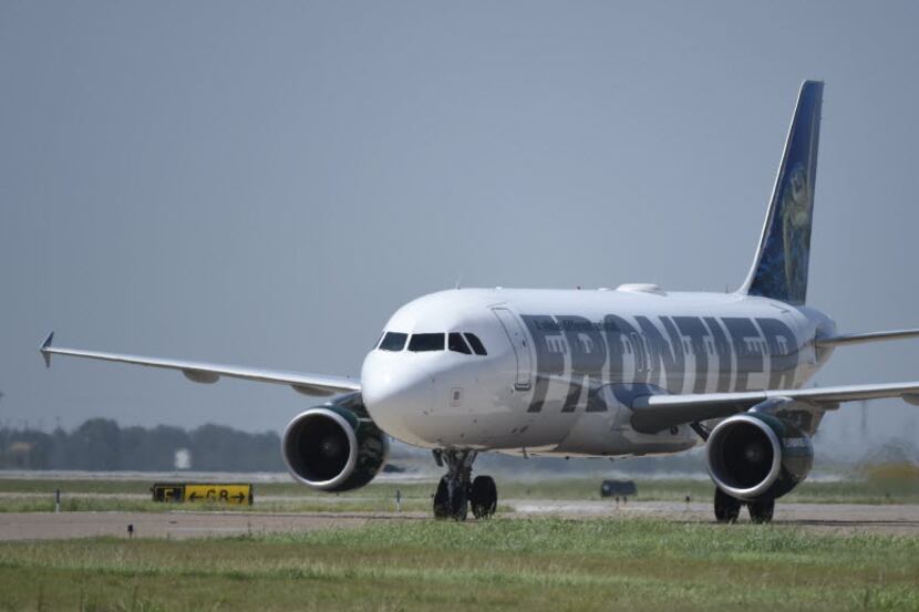 A Frontier Airlines plane at Dallas-Fort Worth Airport on July 1, 2014.  (Michael...