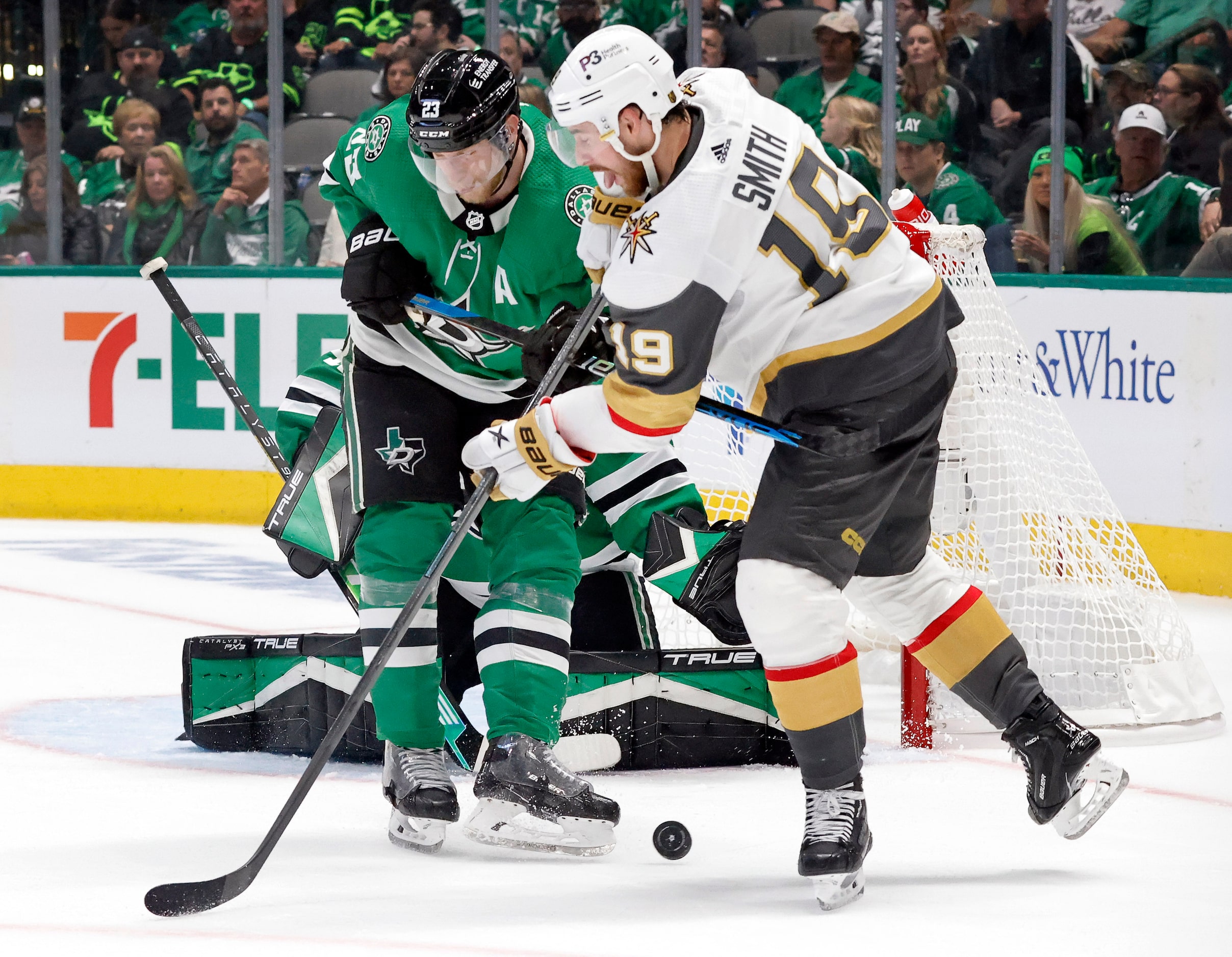 Dallas Stars defenseman Esa Lindell (23) and Vegas Golden Knights right wing Reilly Smith...