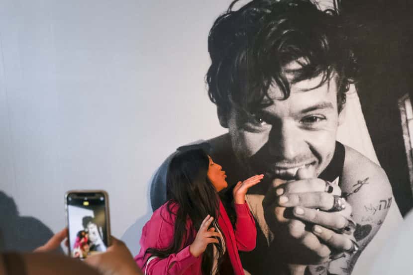 Itzel Ramirez blows a kiss to a photo of Harry Styles on Friday at the Harry’s House pop-up...