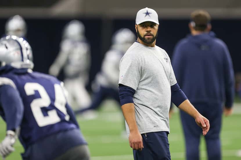 Defensive backs coach Kris Richard works with players during team practice Tuesday, January...