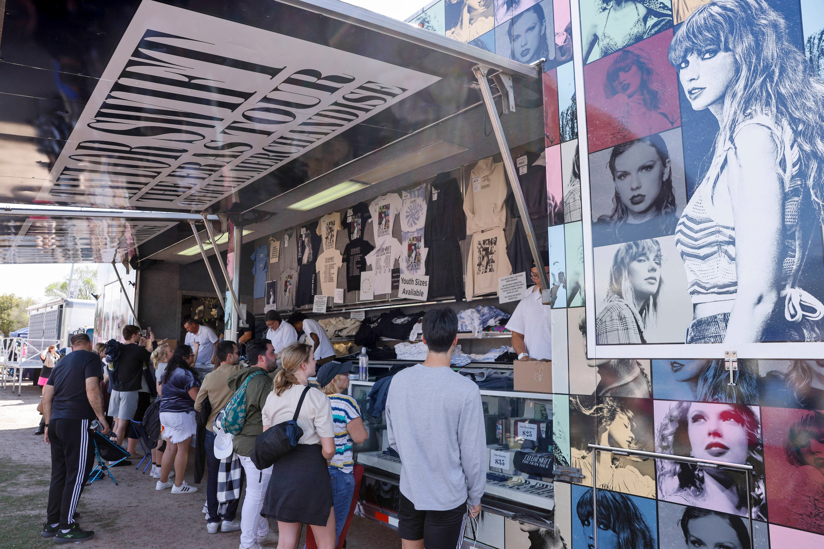 Fans buy Taylor Swift merchandise before a Taylor Swift Eras Tour concert at AT&T Stadium.