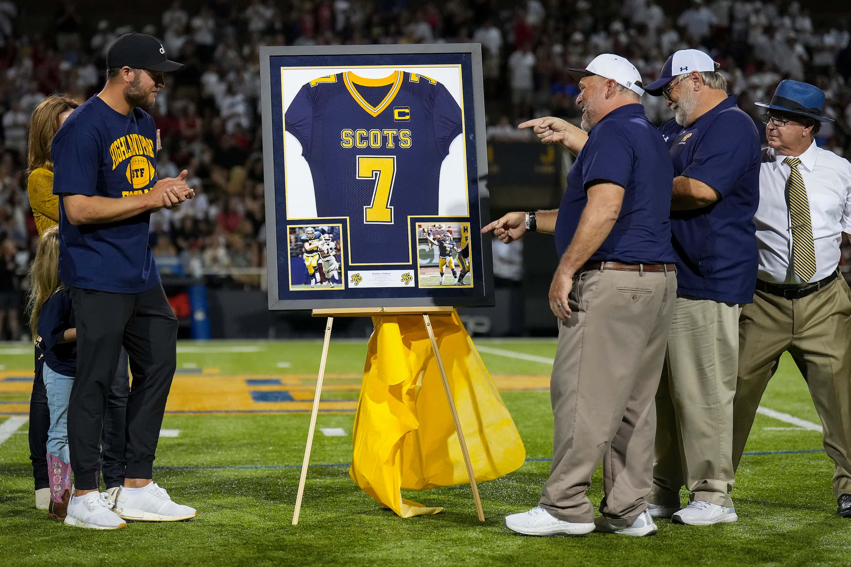 Los Angeles Rams quarterback Matt Stafford applauds during a ceremony to retire Stafford’s...