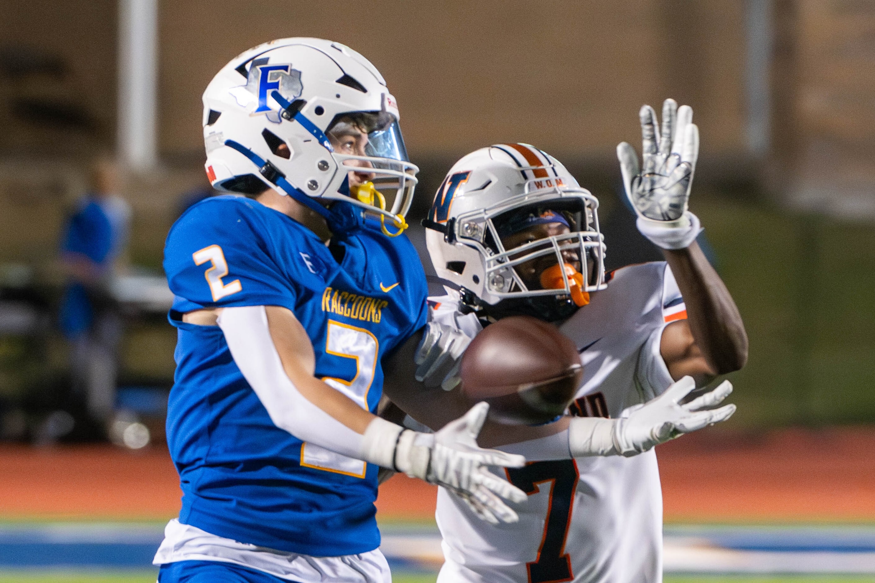 Frisco's Jackson Voris (2) can’t hold onto a pass as he’s defended by Wakeland's Trenton...