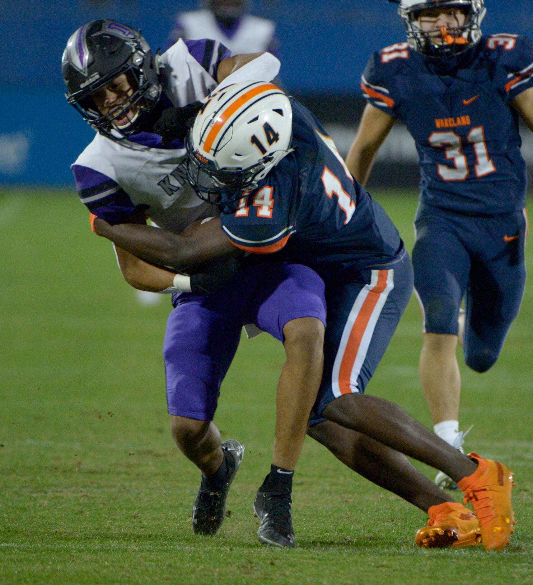 Frisco Independence’s Jordyn Tyson is tackled by Wakeland’s  Noah Mangham (14) in the second...