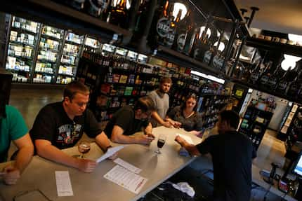 Craft Beer Cellar's bar was surrounded by shelves selling beer for retail.