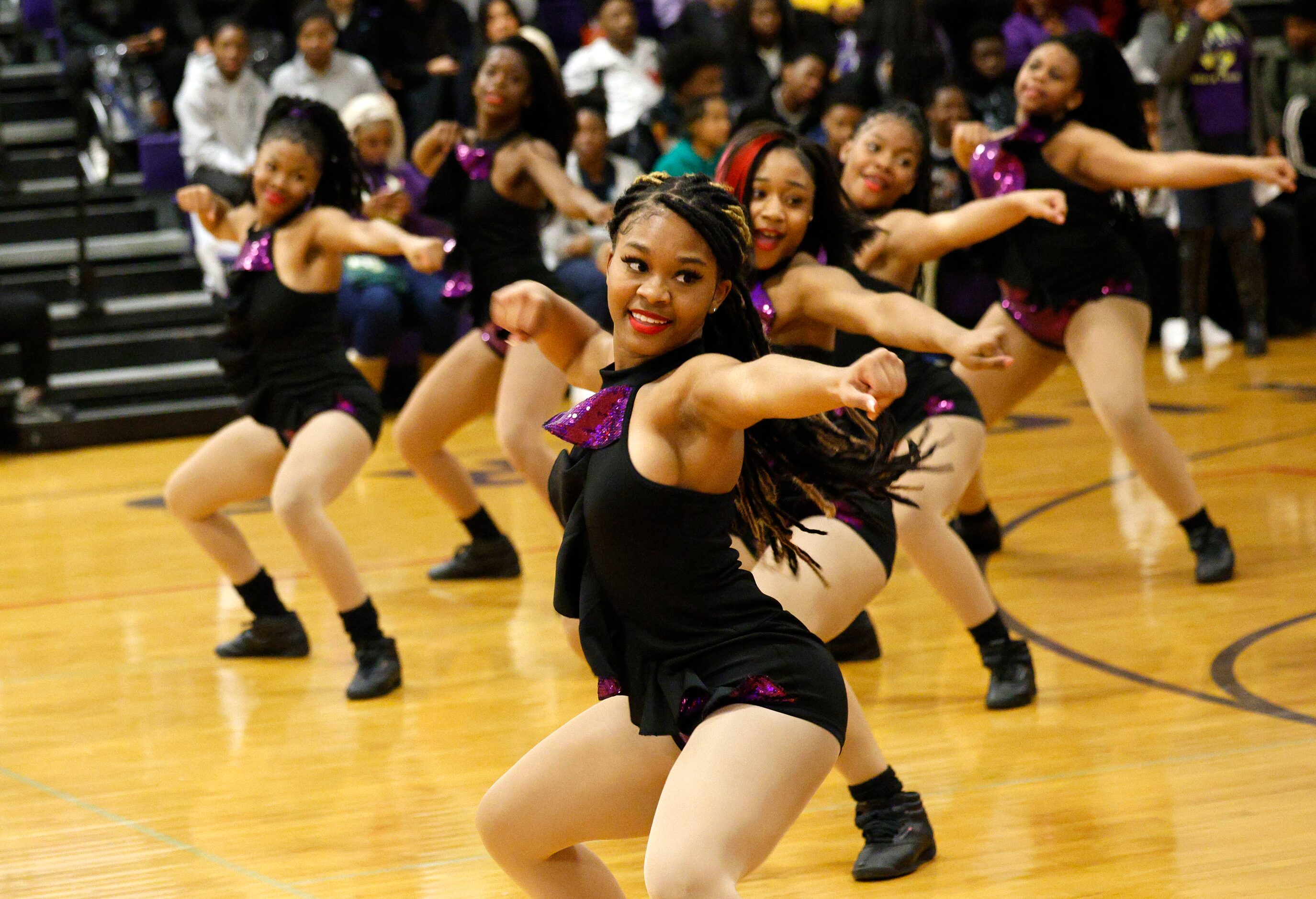 Lincoln High School dance team members perform during a send-off event for their girls...