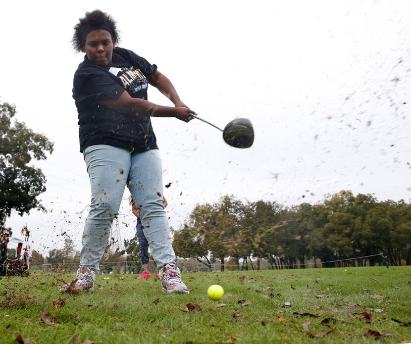 Bri'an Lewis  from Lincoln High School just misses the ball on a drive during Fairway to...