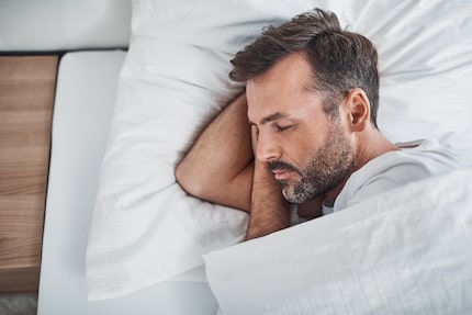 Man sleeping peacefully in bed