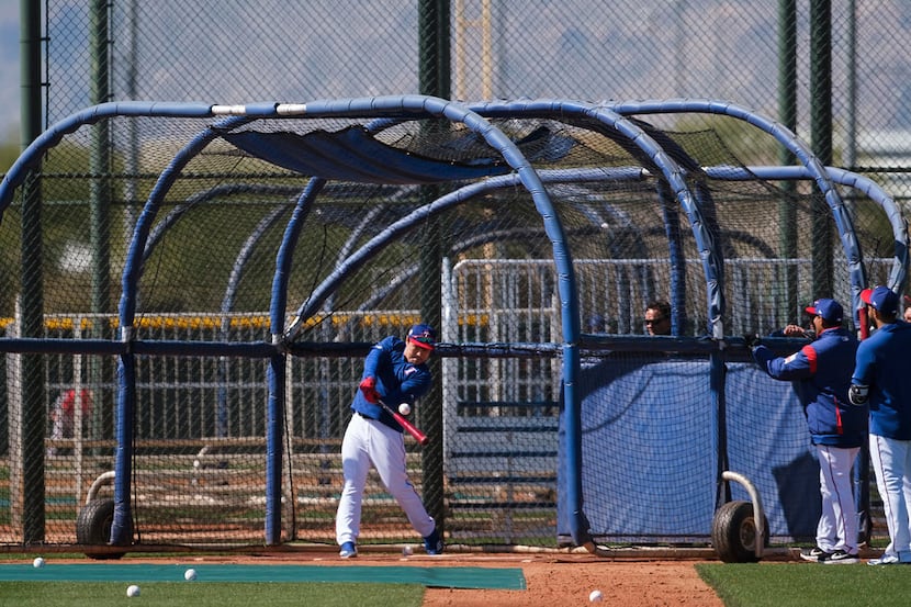 Texas Rangers outfielder Shin-Soo Choo takes batting practice during a spring training...