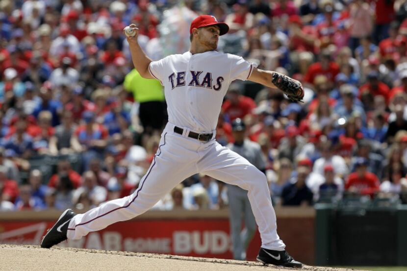Texas Rangers starting pitcher Justin Grimm (51) throws in the first inning of a baseball...