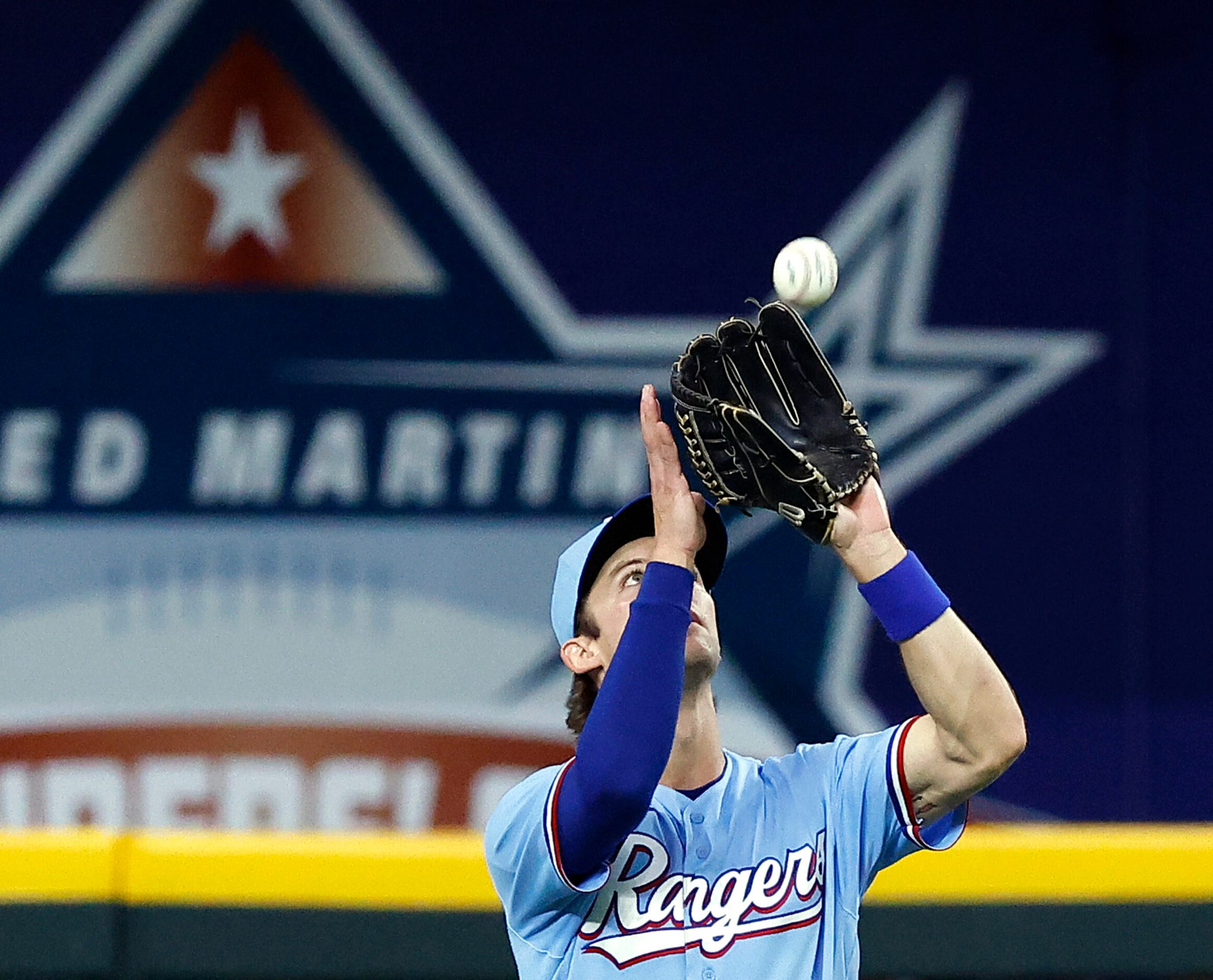 Texas Rangers shortstop Eli White (41) makes the out of Kansas City Royals batter Ryan...