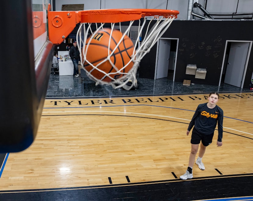 Eighth grader Finley Chastain from Celina watches her ball go through the net as she...