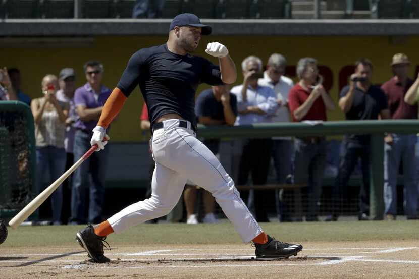 Former NFL quarterback, Tim Tebow hits during batting practice for baseball scouts and the...