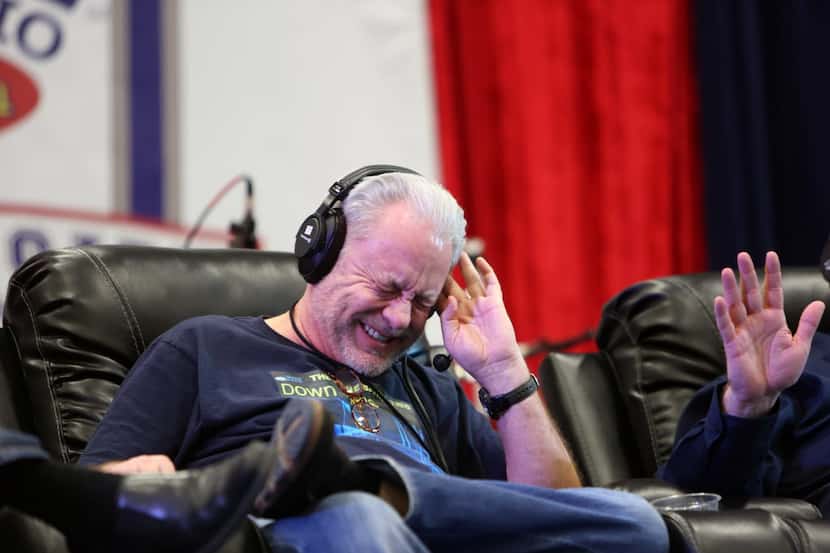 The Ticket Sports Radio's Mike Rhyner laughs during a panel discussion celebrating the 20th...