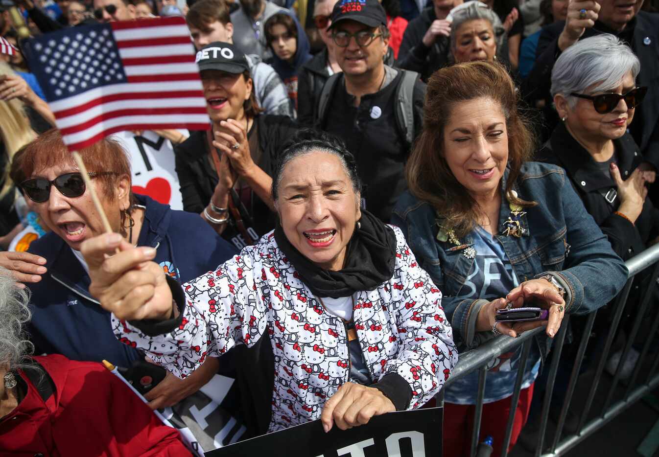 Rosa Guerrero (center) of El Paso sings along with the national anthem at a Beto O'Rourke...