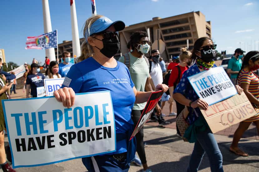 Demonstrators took to the streets of downtown Dallas after a Count Every Vote rally at City...