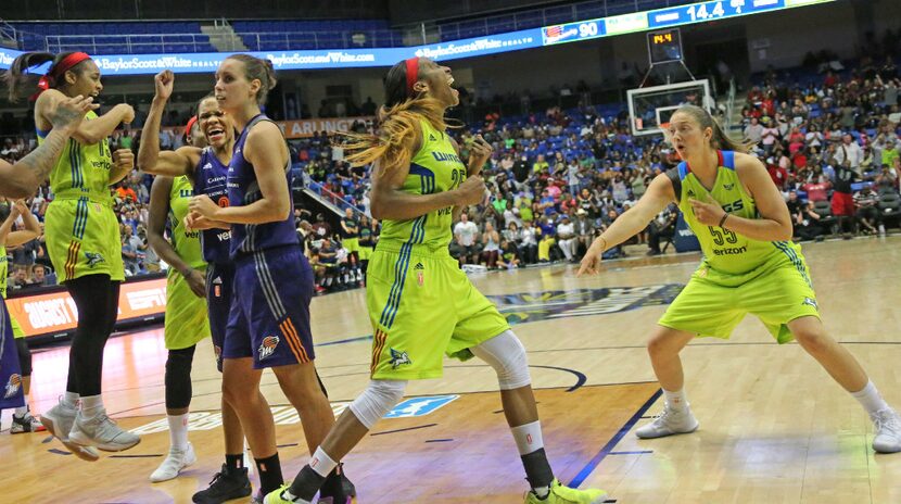 Dallas Wings forward Glory Johnson (25) and forward Theresa Plaisance (55)celebrate a fourth...