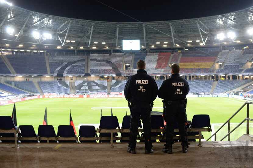 Police looks at the pitch after the friendly football match Germany vs the Netherlands was...